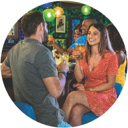 Man and Woman Sharing Drinks